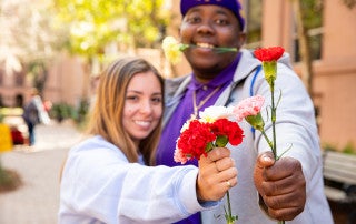 Students at CofC celebrate Valentines day with flower.