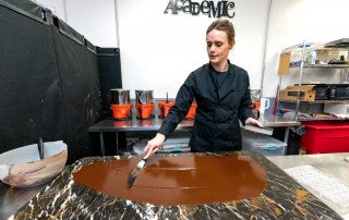Bethany Moore Owner and Chocolatier of Cocoa Academic demonstrates her process for making Cocoa Academic chocolate.