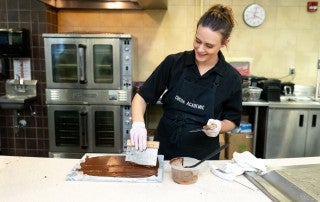 Bethany Moore, owner and chocolatier at Cocoa Academic demonstrates how to make chocolate from "bean to bar" for College of Charleston students on Tuesday, February 18, 2020.