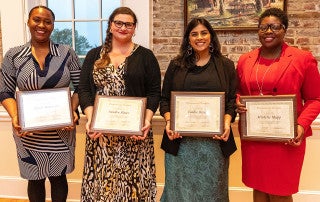 Phenomenal Women Award recipients Alumna Michelle Mapp, professor Sandra Slater, staff member Marla Robertson and student Cookie Desai