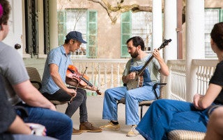 The Pluff Mud String Band performs to a small class on the College of Charleston campus.
