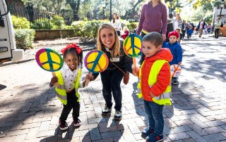 The students of ECDC walked through the College of Charleston Campus promoting peace and holding up signs of peace in the 2020 Peace Parade.