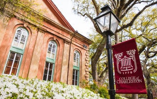 towell library with cofc flag and flowers