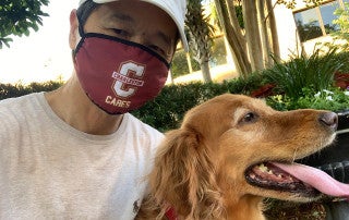 President Hsu with Hoosier the dog