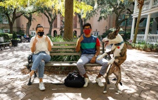 Students, faculty and staff all wearing masks on campus.