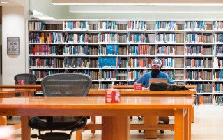 student studying in addlestone library