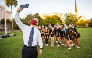 President Hsu visits CofC cheerleading practice in Marion Square.