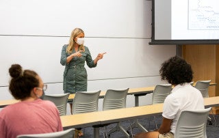 Devon Hanahan teaches class during COVID