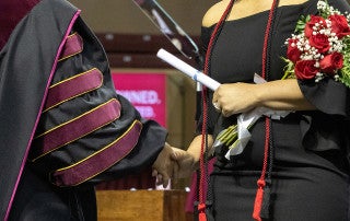 a graduate holds a diploma