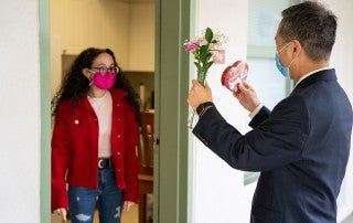CofC President Andrew Hsu delivers candygrams to students for Valentines Day.