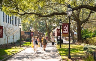 students walking on the college of charleston campus