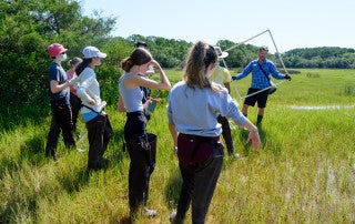 high school students in marsh