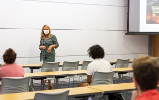 Instructor Devon Hanahan Wears Mask in classroom