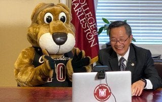 President Hsu and Clyde welcome early acceptance students.