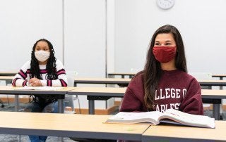 students wear face masks in a classroom
