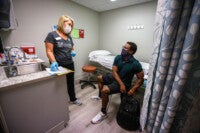 a student speaks with a nurse at cofc's student health services