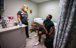 a student speaks with a nurse at cofc's student health services