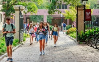 students walking on the college of charleston campus