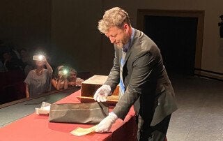 dean john white removes papers from the time capsule