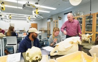 Professor and Students learn about Fossils