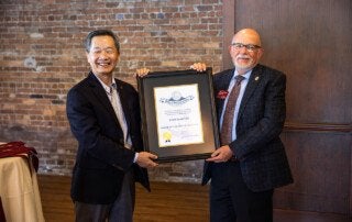 Andrew Hsu Presents Governor's Award to Tom Martin