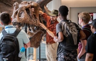 Professor talks about dinosaurs at the Mace Museum