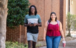 friends walk together at the College of Charleston