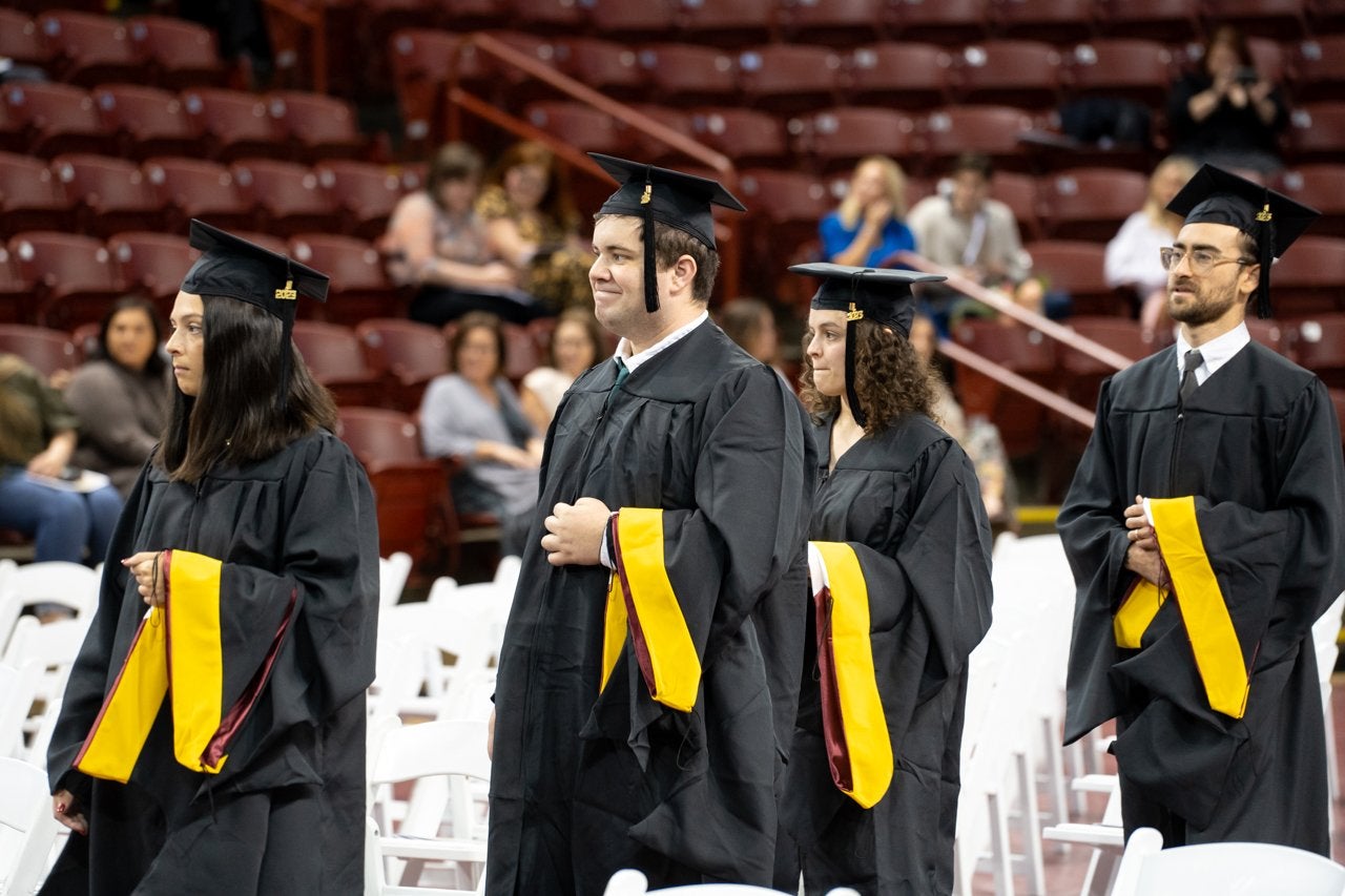 graduates walking into TD Arena