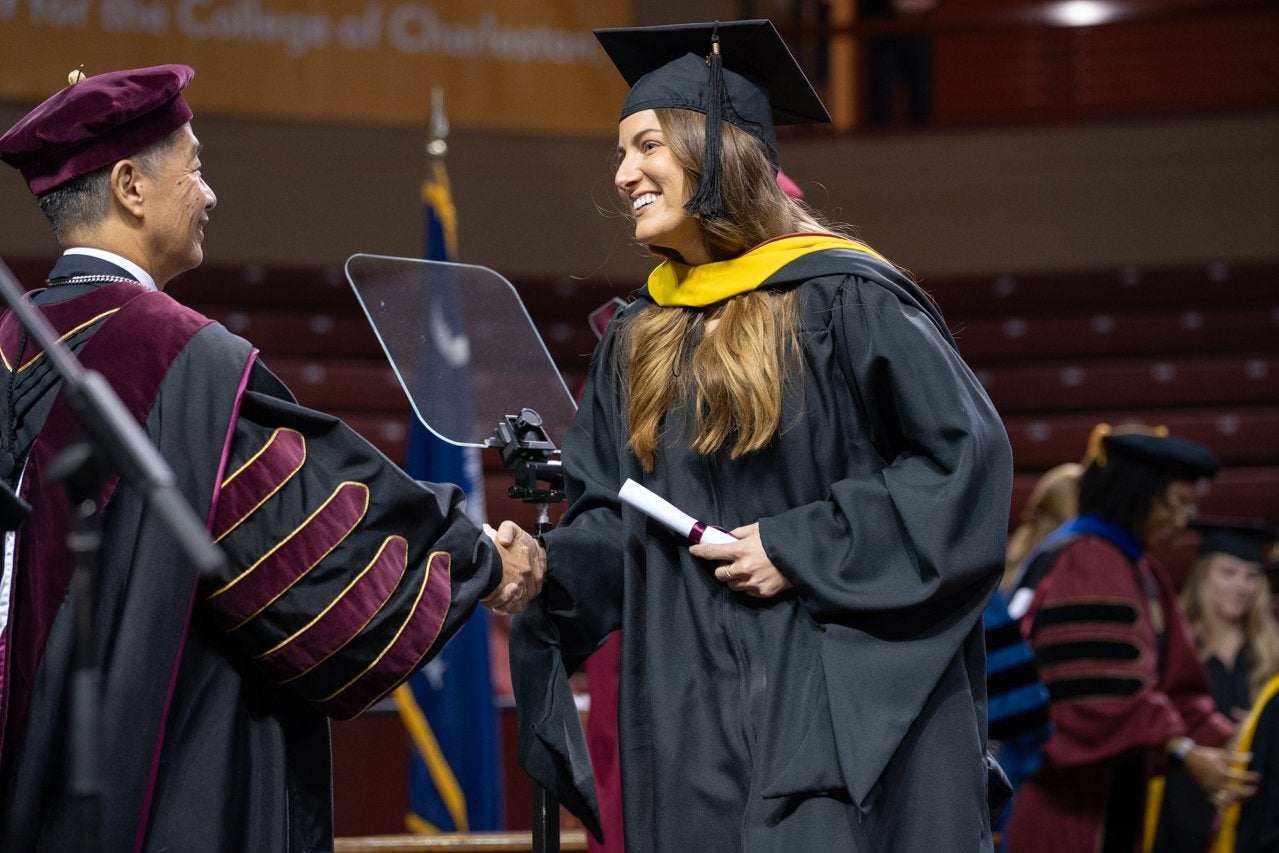 grad student receives diploma