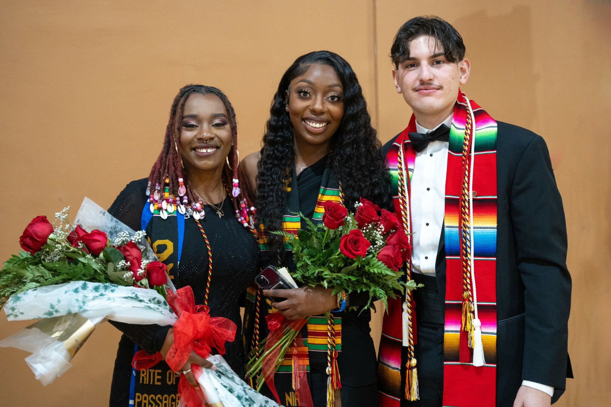 students pose before winter commencement
