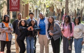 students pose together back on campus