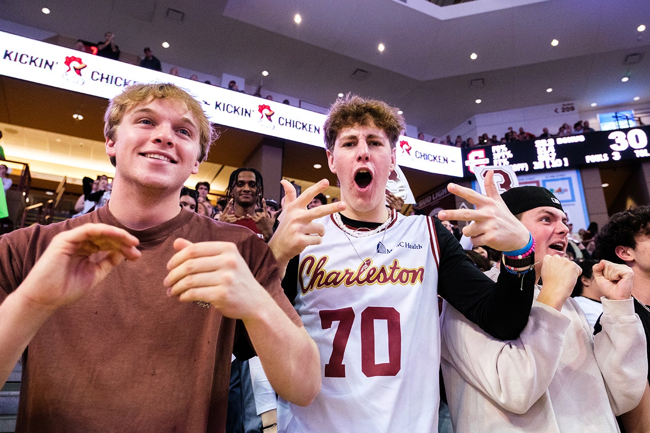 students get excited at basketball game