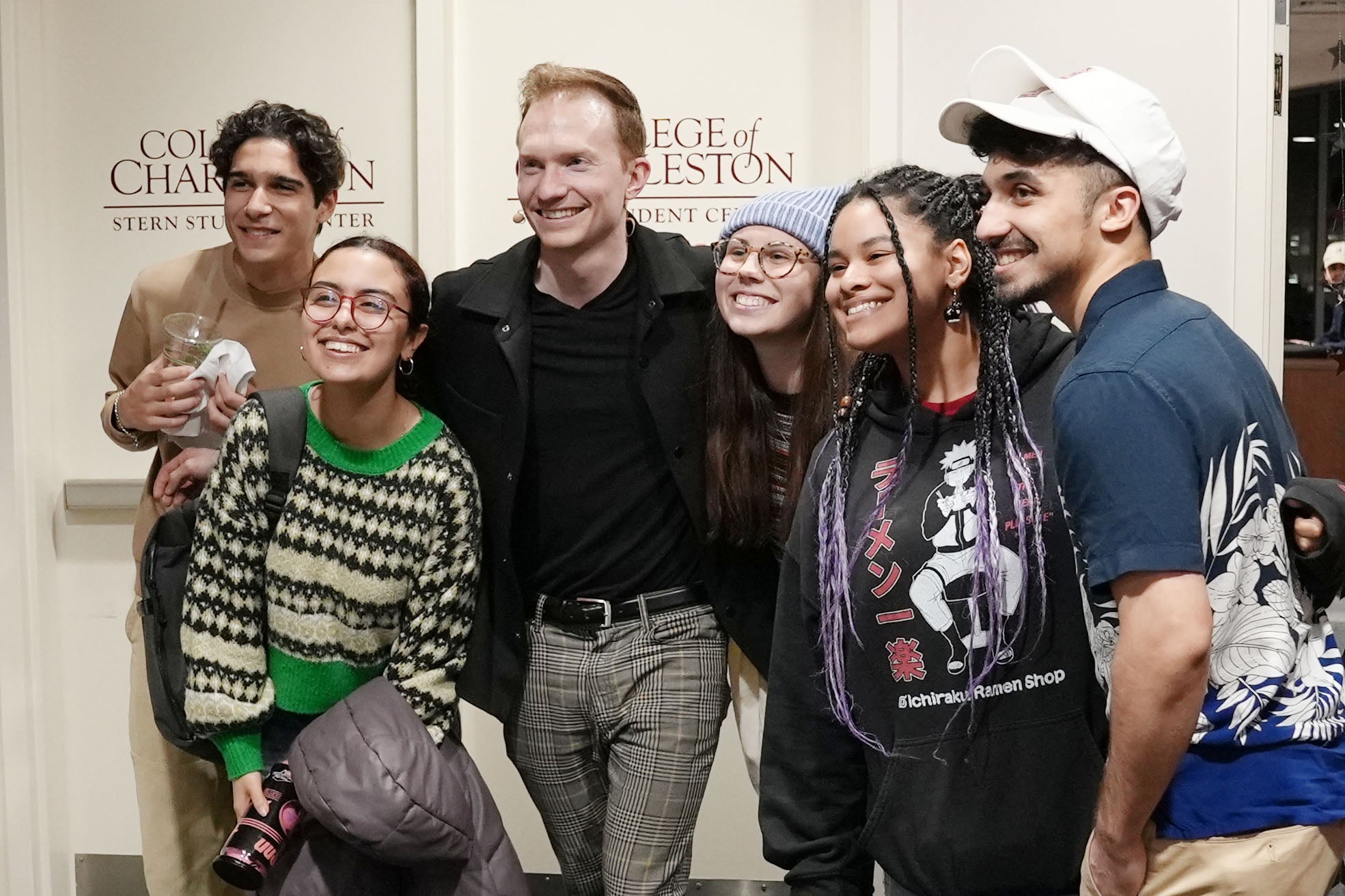 Trigg Watson magician poses with students at stern center