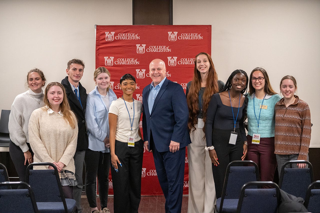 students pose with Mitch Landrieu